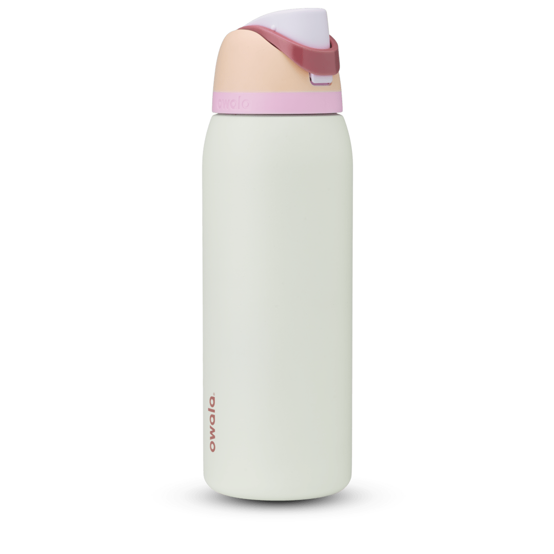FreeSip 40oz water bottle, off-white cream body with blush pink and white color-block lid, flip cap, and carry loop